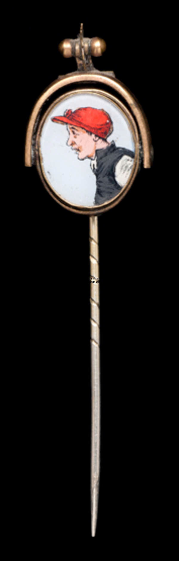 A gold & intaglio reversible stick pin of the jockey Fred Archer, the intaglio set in a stirrup desi...