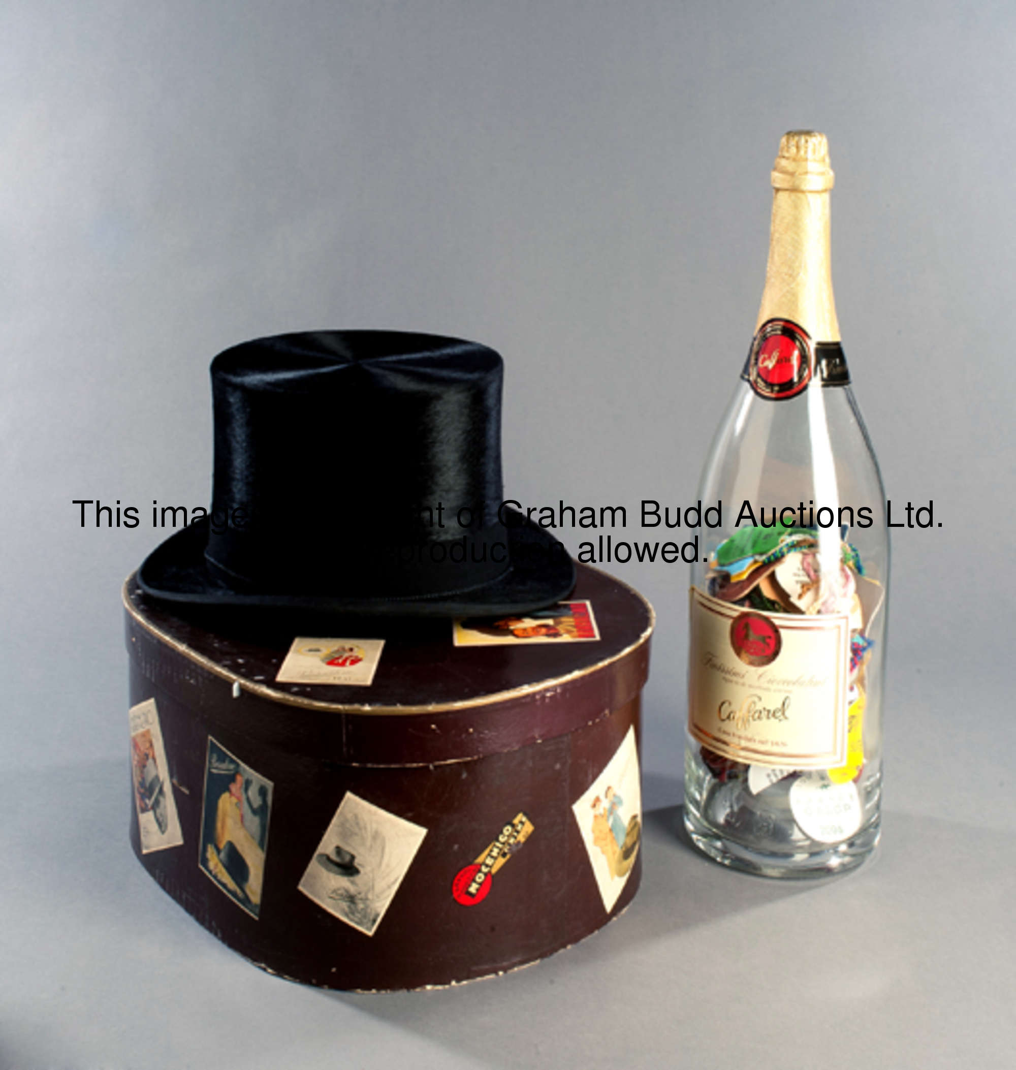 A Lincoln Bennett black silk top hat, stamped 'extra quality, By Appointment to H.M. The King and H....
