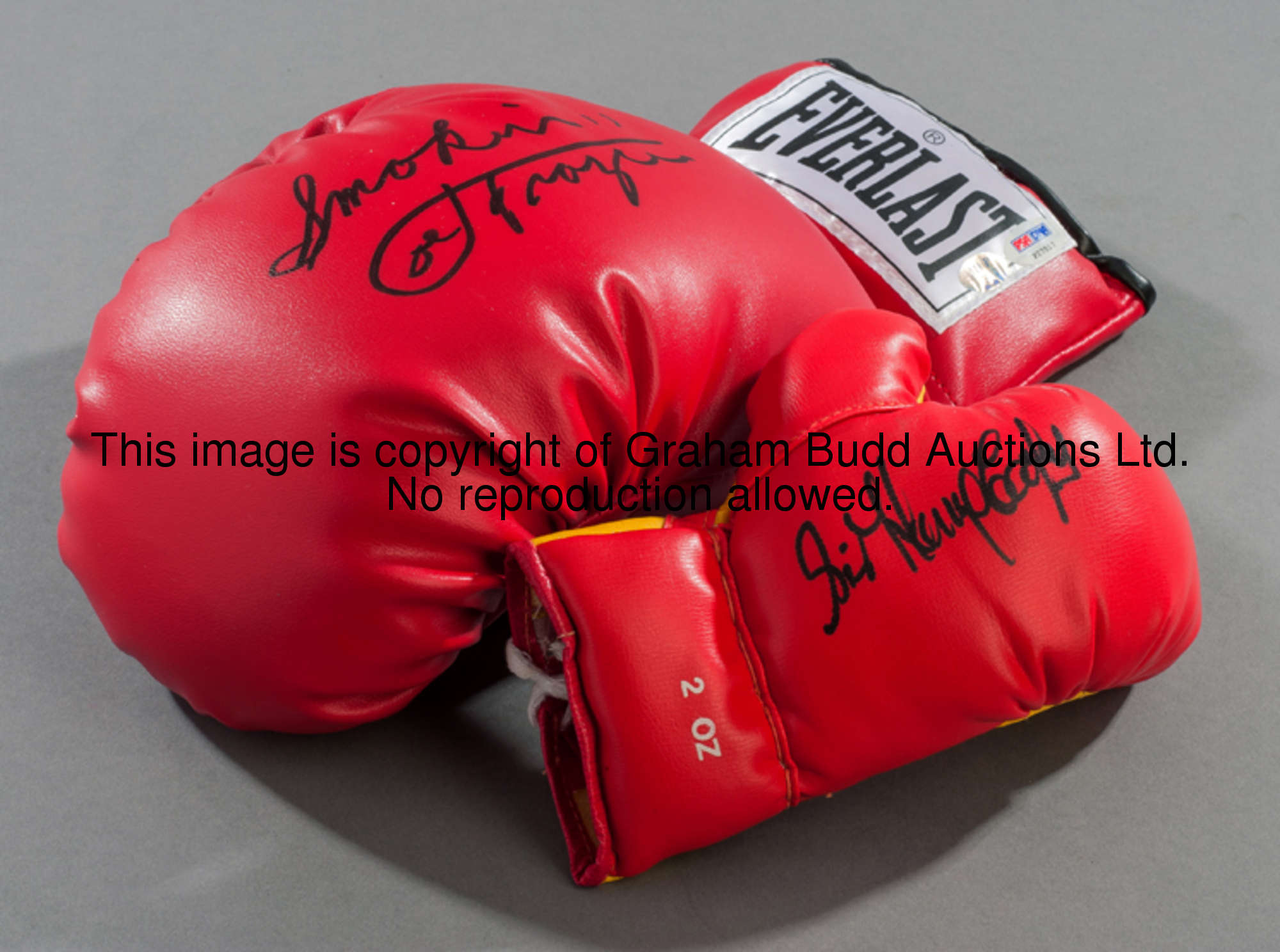 Signed boxing memorabilia, comprising: a Joe Frazier signed boxing glove (with certificate of authen...