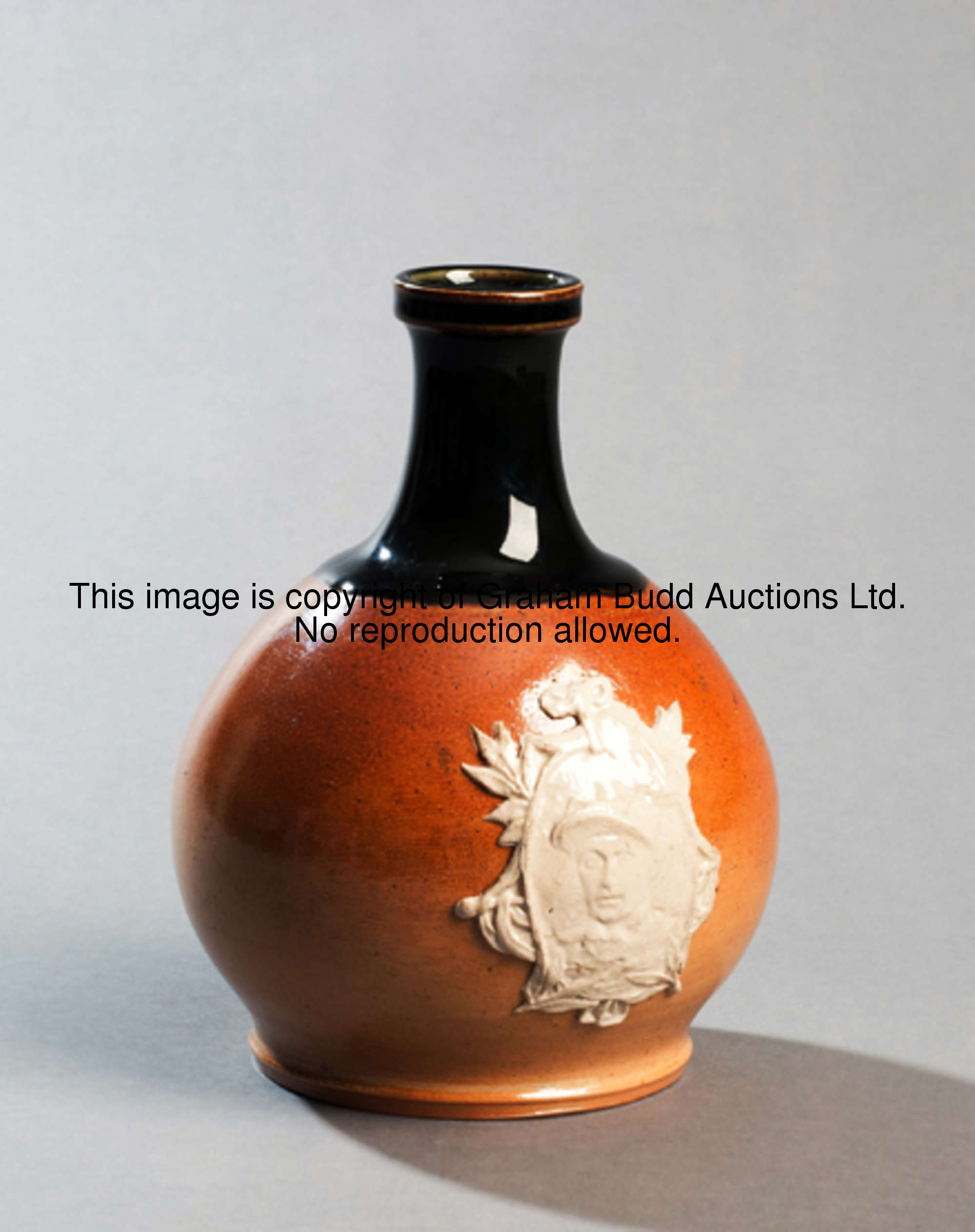 A Doulton Lambeth stoneware flask with applied portrait of Fred Archer circa 1886, of bulbous form, ...