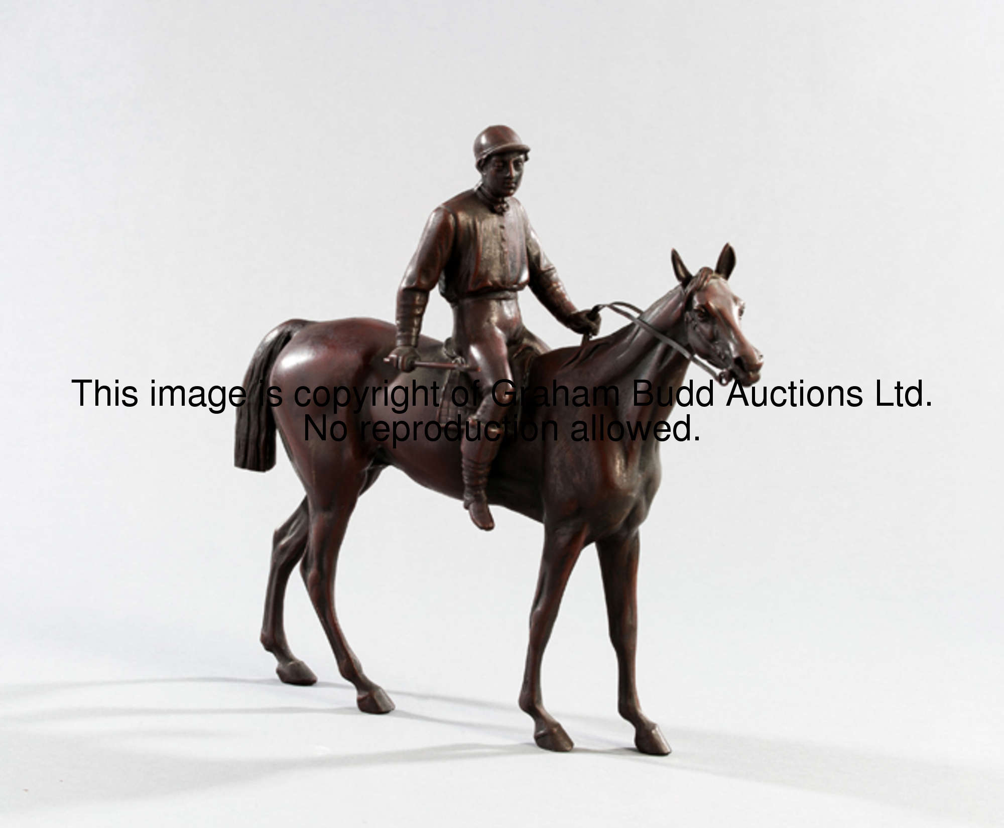 A bronze of a racehorse & jockey, rich, brown patina, lacking original plinth, height 28.5cm., 11 1/...