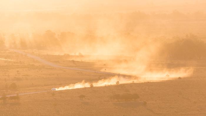 Dusty road at sunset