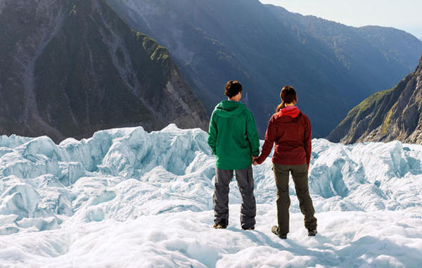 Couple standing ona glacier