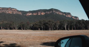 Photo of the blue mountains taken from the window of a car