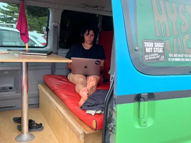 Working from a laptop inside the Mystery Machine camper