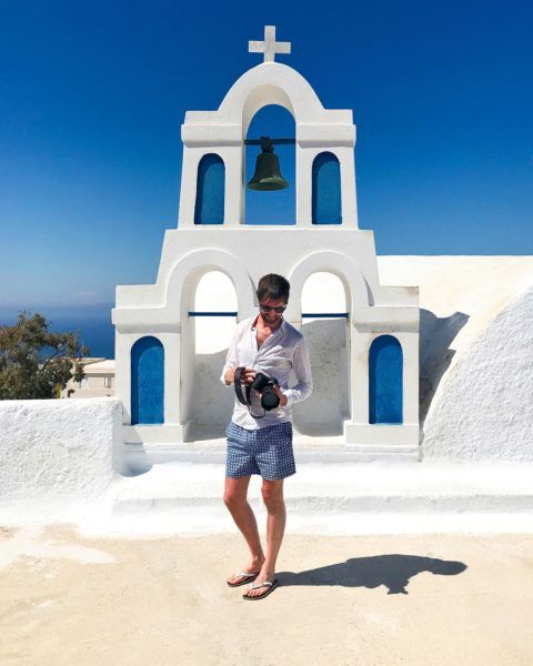 Yannick Dixon taking pictures in Oia, Santorini