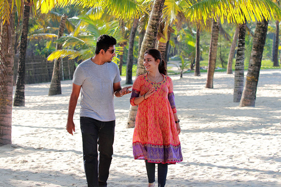 Romantic couple walking in the kerala beach