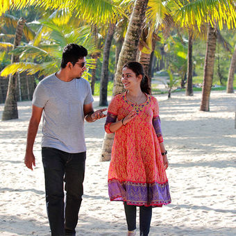 Romantic couple walking in the kerala beach