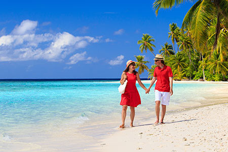 Loving couple walking on beach