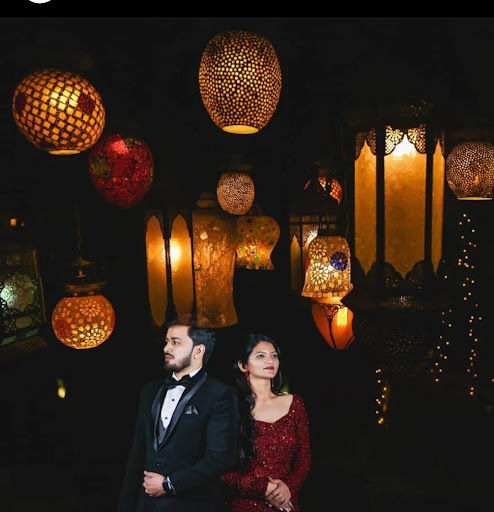 Premium Photo | Indian attractive couple in traditional wear celebrating  diwali festival, birthday or anniversary with surprise gifts and sweet  laddoo against decorated background with marigold flowers