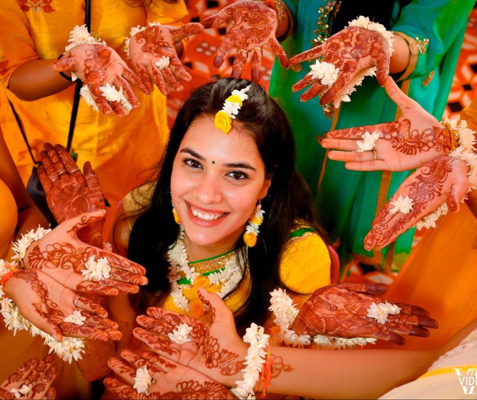 An Indian Woman Posing While Showing Off The Henna Applied On Her Hands  High-Res Stock Photo - Getty Images