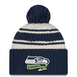 Seattle Seahawks New Era 2022 Cream NFL Sideline Sport Pom Cuffed Knit Beanie Hat