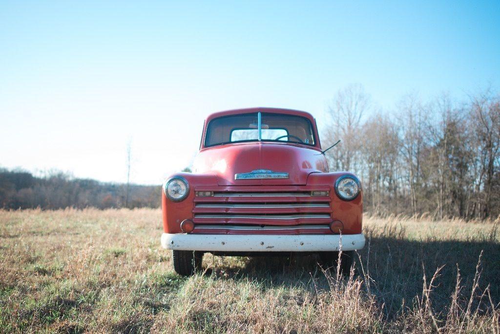 Red 1950 Chevy 3100 pickup truck