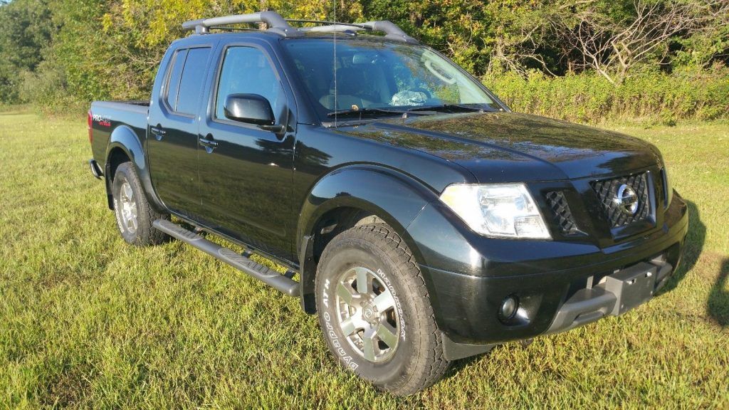 has few dents 2011 Nissan Frontier Pro4X pickup
