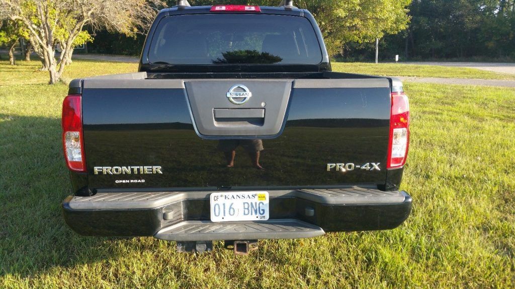 has few dents 2011 Nissan Frontier Pro4X pickup