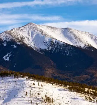 Scenic view of a snowcapped Humphreys Peak in the San Francisco Peaks near Flagstaff, Arizona on a sunny day.