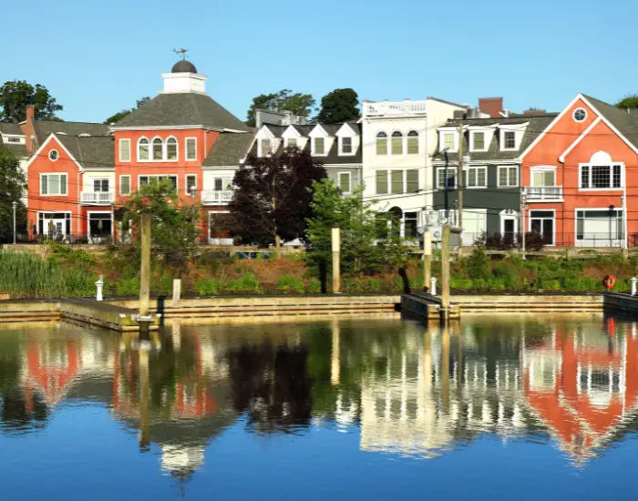 Milford, Connecticut city with red, white, and navy buildings along a river.