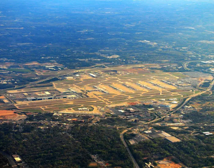 Aerial view of Hartsfield-Jackson Atlanta International Airport in Georgia with runways, landing strips, and highways.