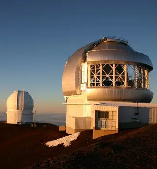 Mauna Kea Observatories on top of Mauna Kea volcanos in Hawaii at sunset.