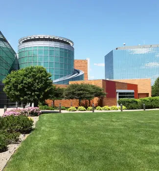 Sioux City buildings in Iowa with a cylindrical structure and tall office buildings encased on reflective glass windows.