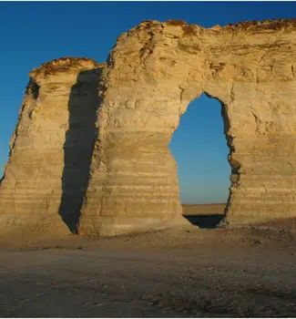 Chalk Pyramids in Western Kansas partly covered by cloud shadows in the middle of a deserted location.