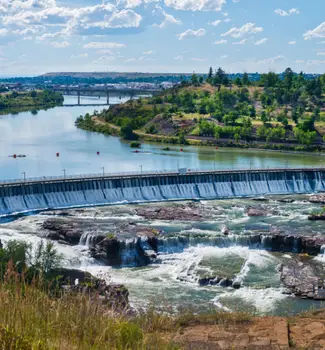 Cascading waterfalls at Great Falls, Montana flowing over a hydroelectric dam over the upper Missouri River.