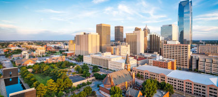 Oklahoma City downtown landscape during sundown with some warm light hues.