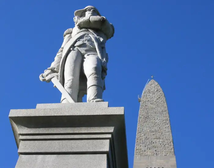 Looking up at the Bennington Battle Monument in Vermont with clear blue skies.