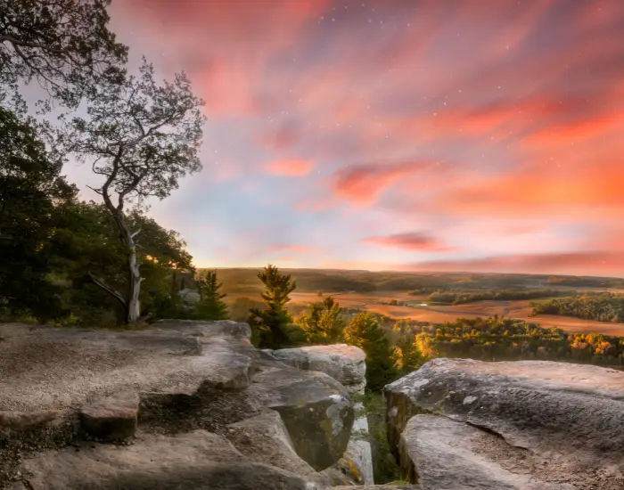 Faint stars disappearing into the morning day in Lodi, Wisconsin above the Gibralter Rock.