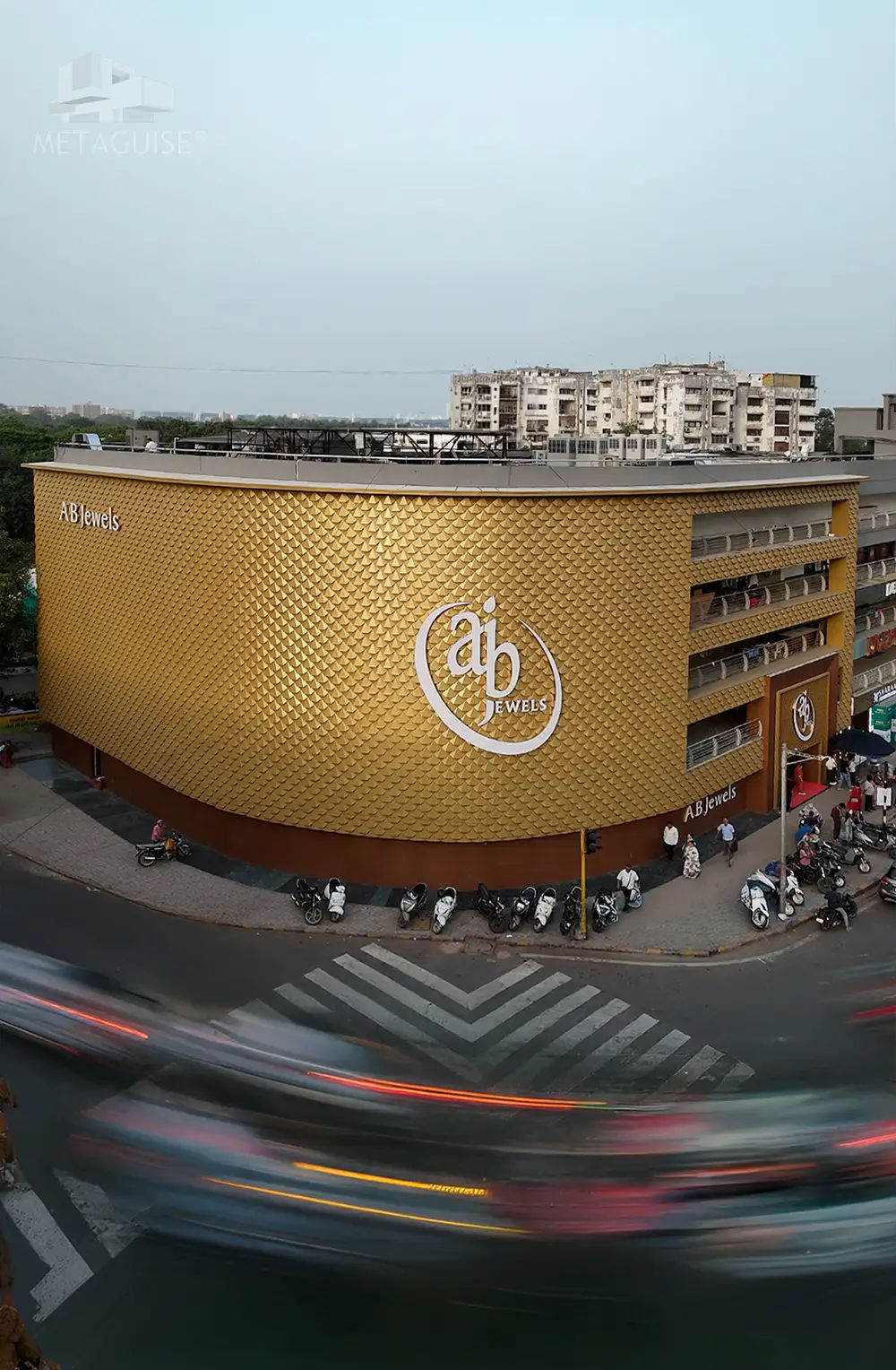 AB Jewels commercial showroom facade featuring gold textured metal cladding elevation and iconic retail building exterior design by Metaguise