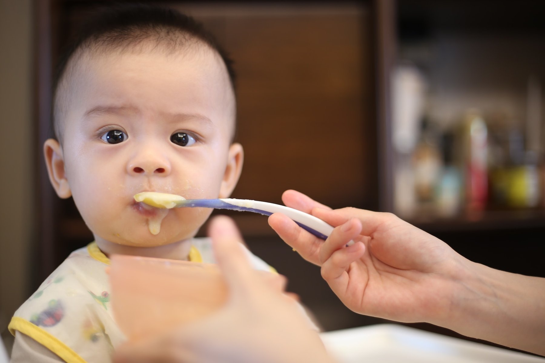 Person feeding children
