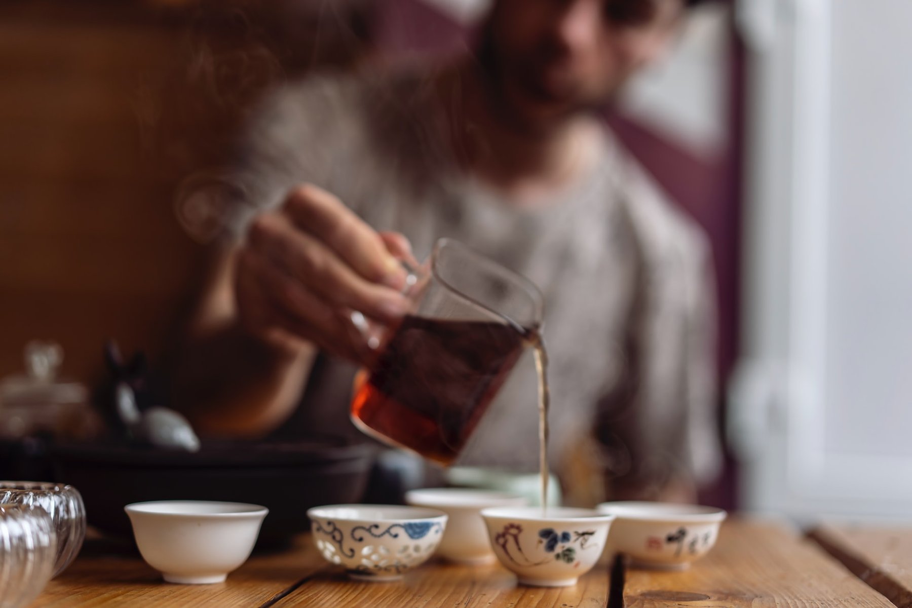 Man pouring tea