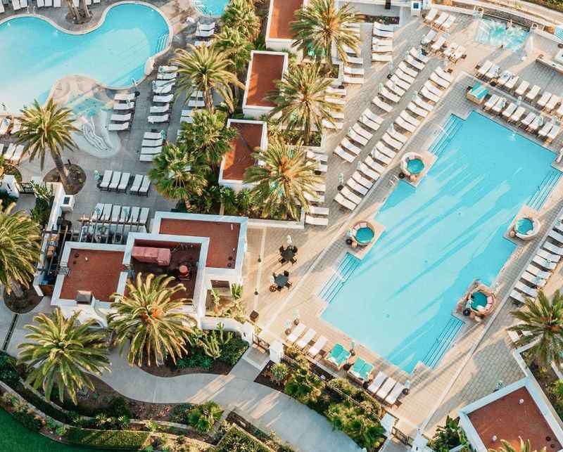 an aerial view of the pool at the resort