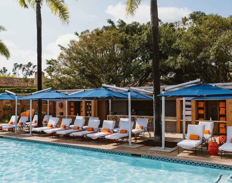 the pool at the resortwith white sunlounger