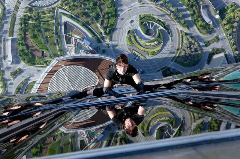 a woman climbing up the building