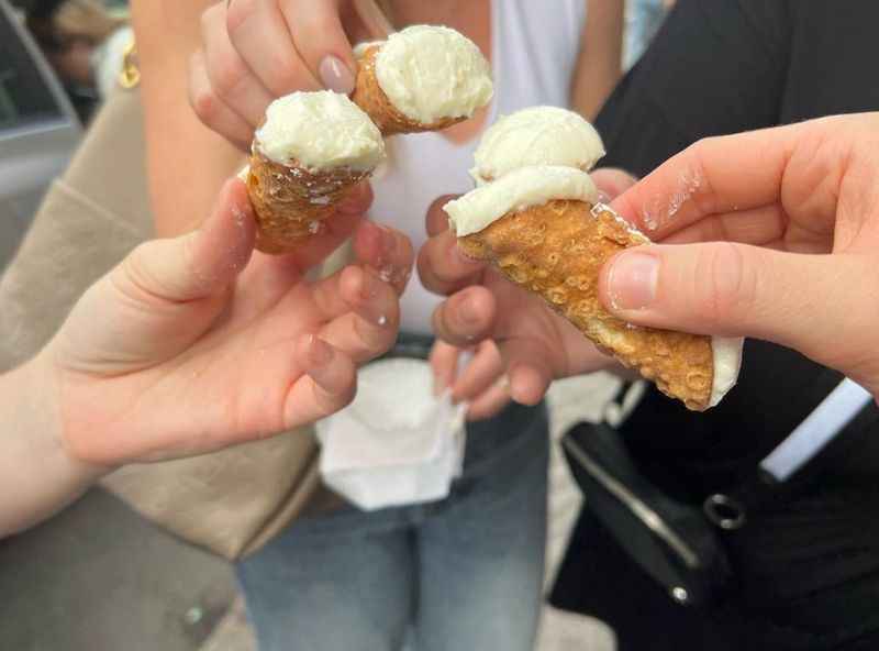 group of people holding a food