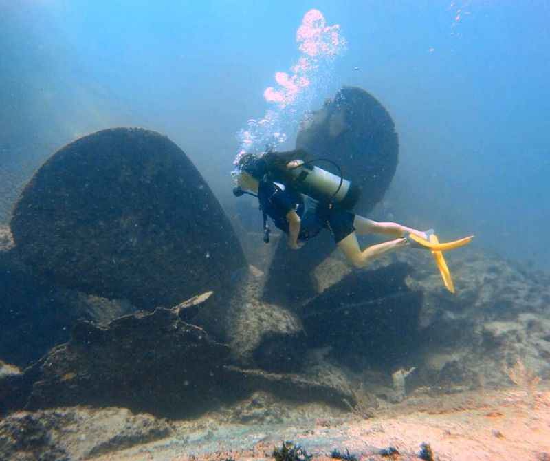 a diver swimming in the ocean