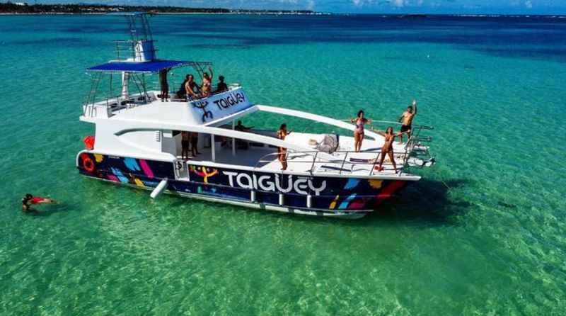 a boat with people on it in the ocean