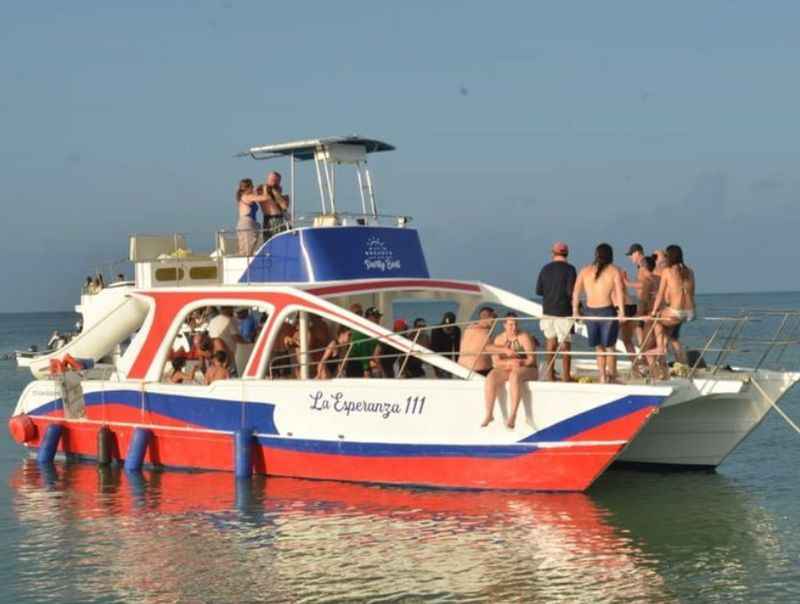 a group of people on a boat in the water