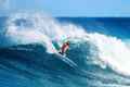 a surfer rides a wave in the ocean