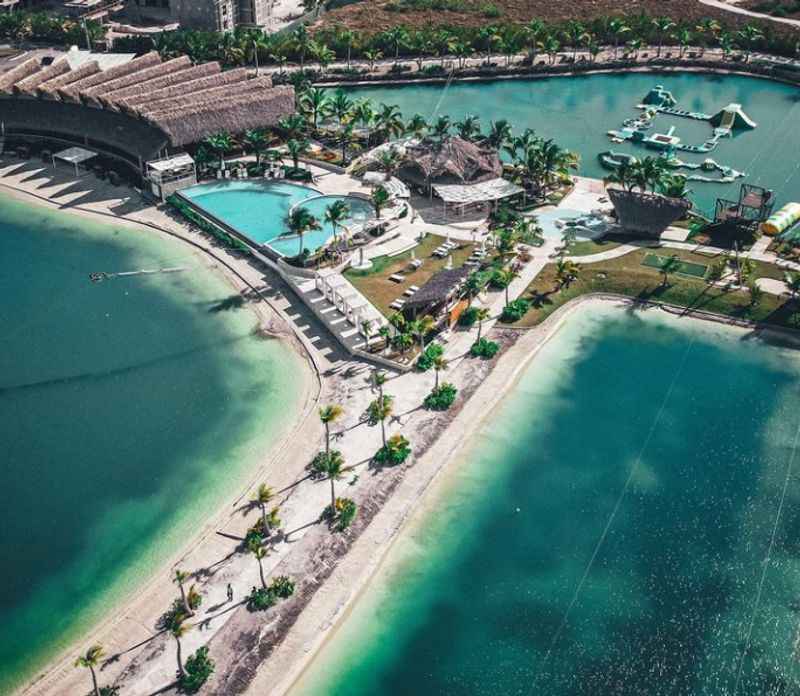 an aerial view of the resort and beach