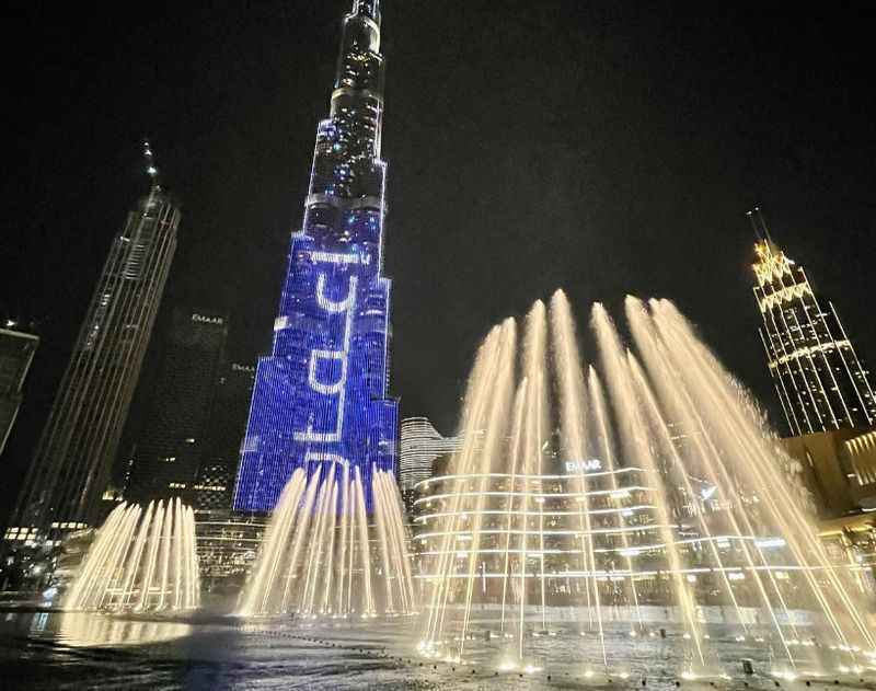 fountain with lights on the street of Dubai