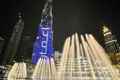 fountain with lights on the street of Dubai