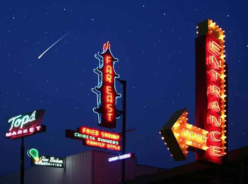 a collection of neon signs in museum