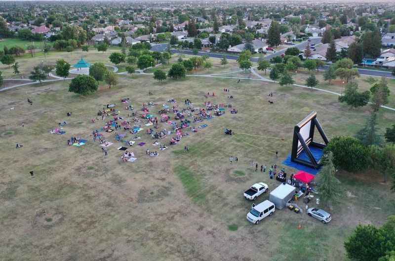 aerial drone photography of a crowd of people in a park