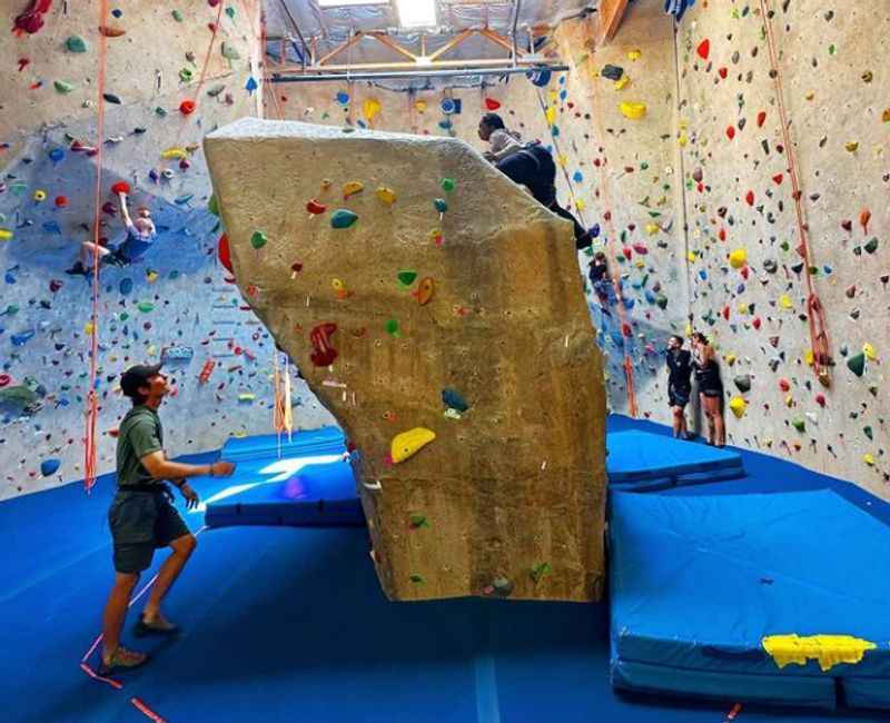 a man climbing on a rock wall