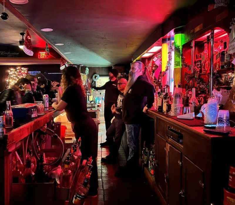 a bar with people  with red lights