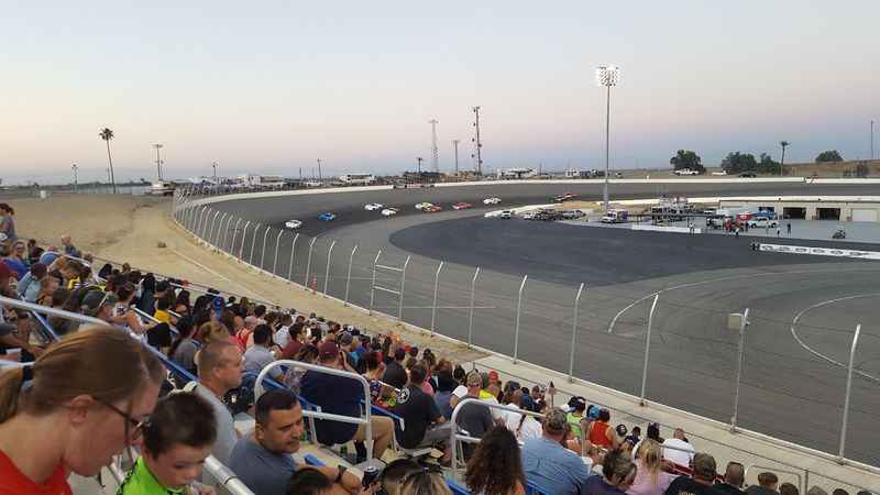 raceway park with lots of people watching