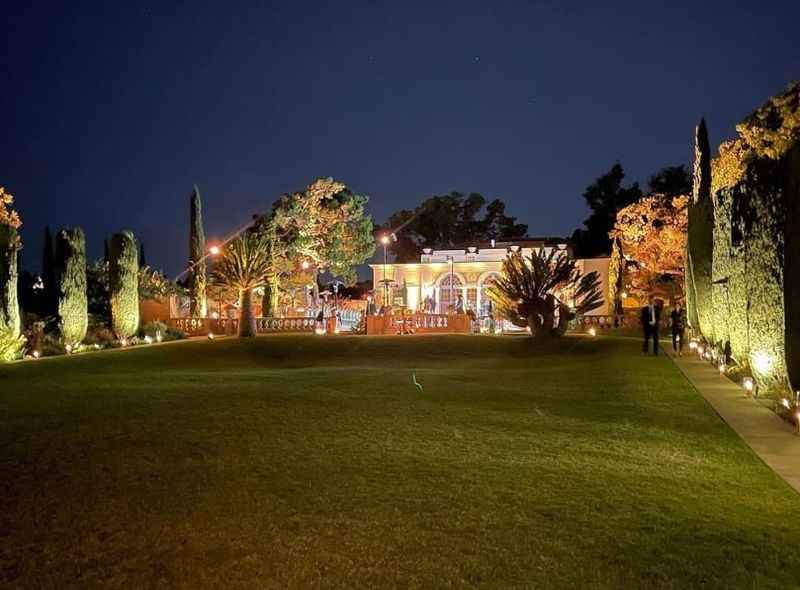 a large yard with a lawn and trees