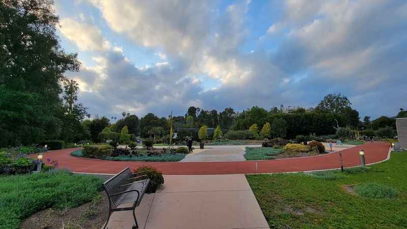 a park with a bench and a path